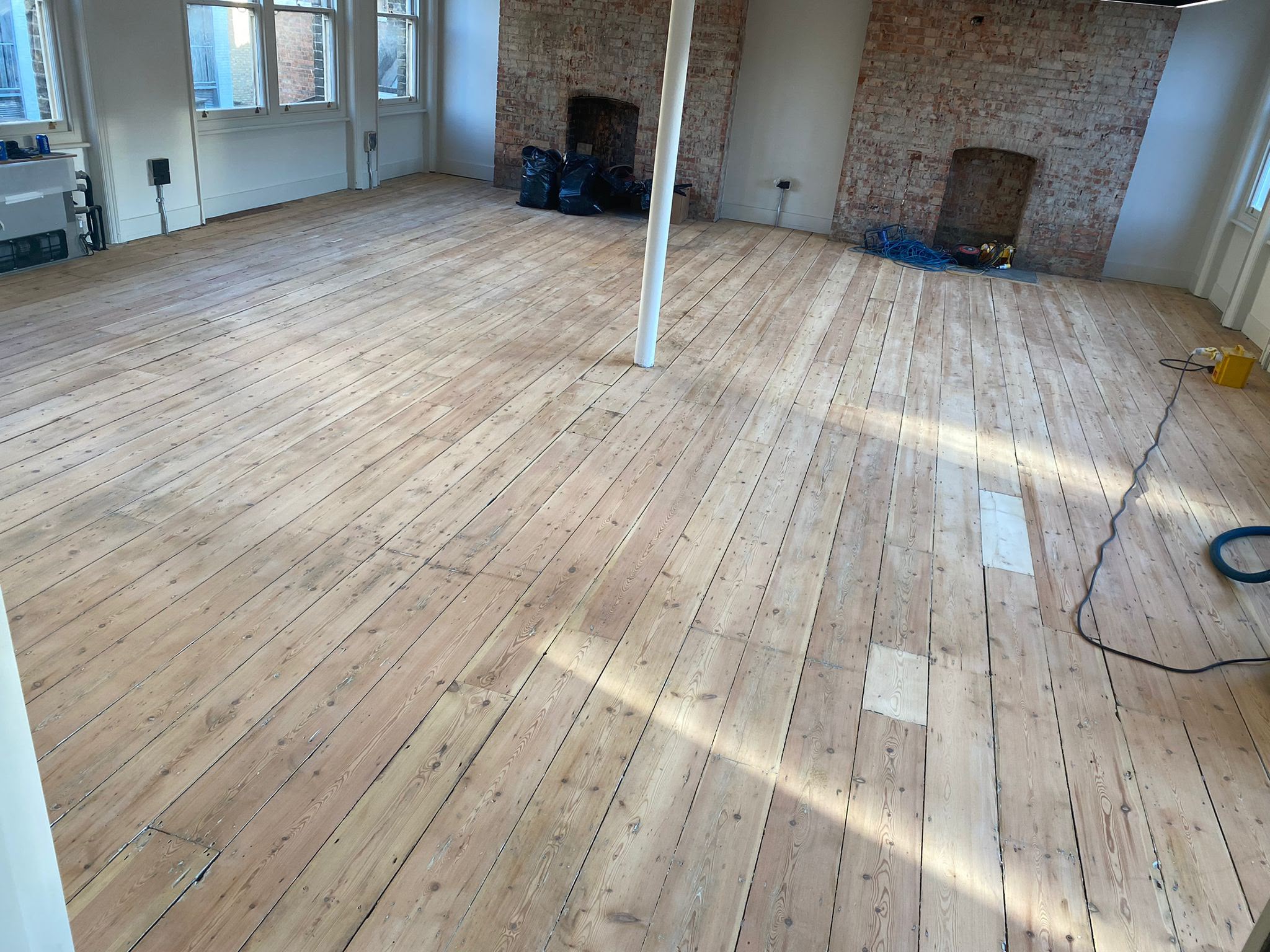 Freshly sanded reclaimed Victorian pine floorboards in a period building